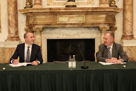 Trevor Fox and John Conlan sitting at a table